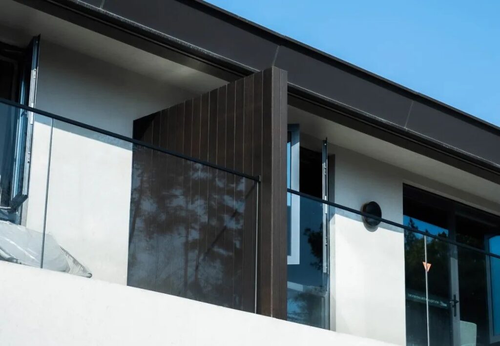 Longyou Water Mirror Hotel- deep charcoal cladding